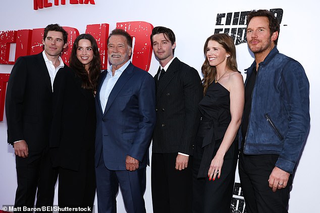 Arnold was dressed up for the premiere in a lustrous dark blue suit. His four oldest children all favored black