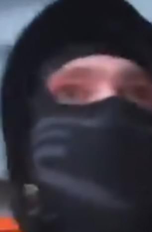 One of the masked men ran out with the kettle and was cheered by crowds outside