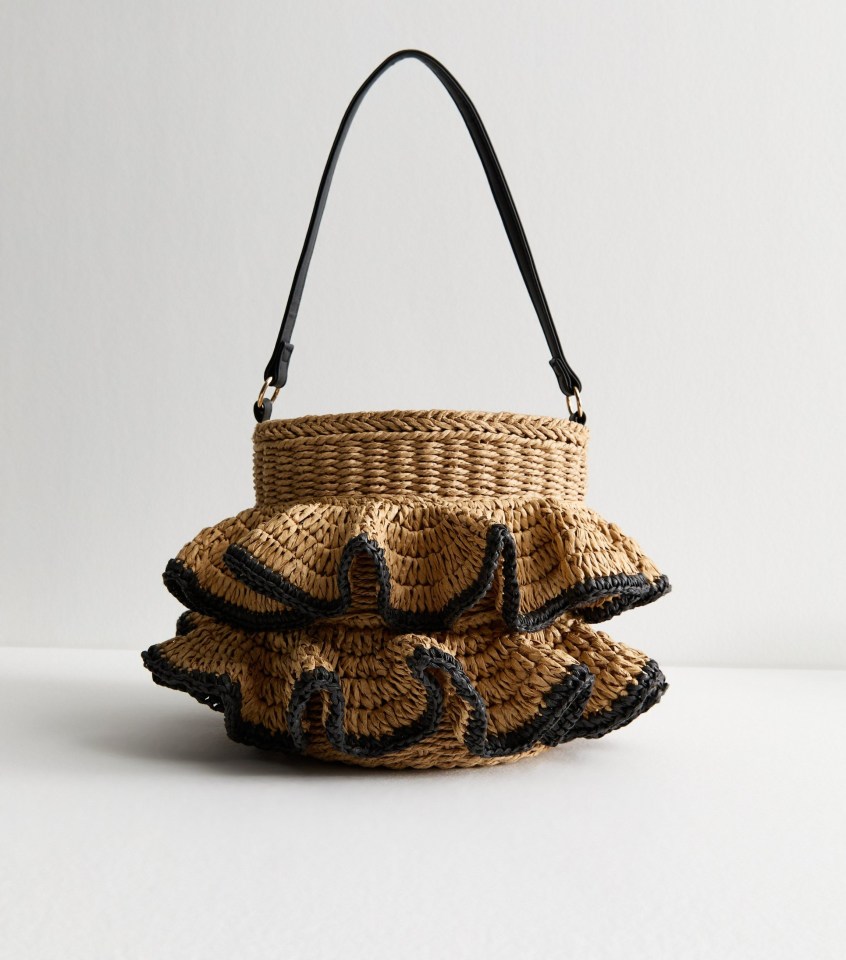 raffia bucket bag with ruffled trim and black handles