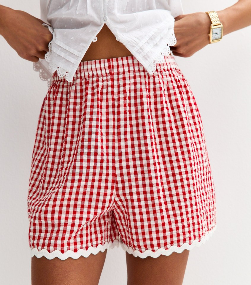 Red and white gingham shorts with scalloped edges.