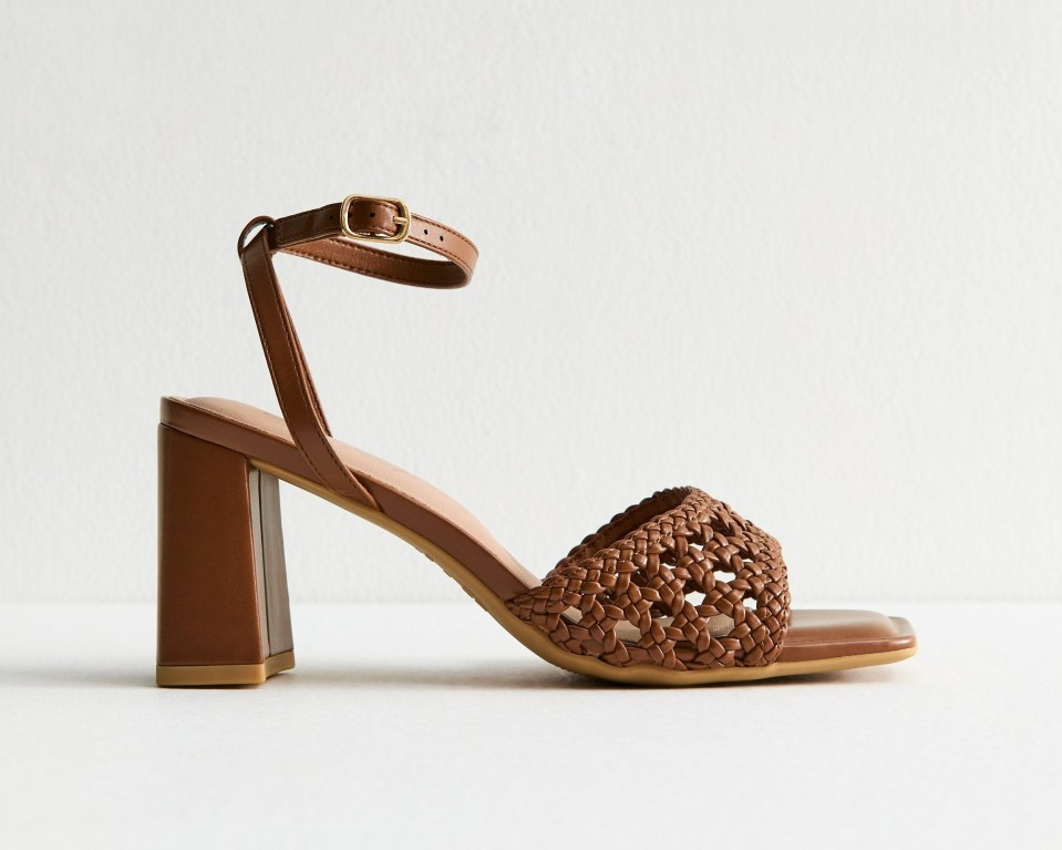 Brown woven leather heeled sandals with ankle strap.
