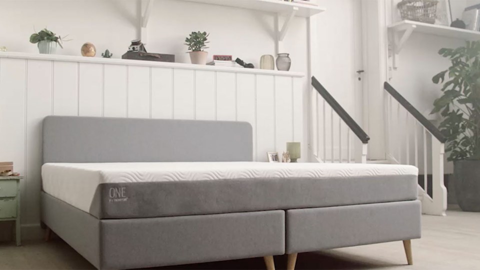 TEMPUR-ONE Medium mattress on a gray platform bed.