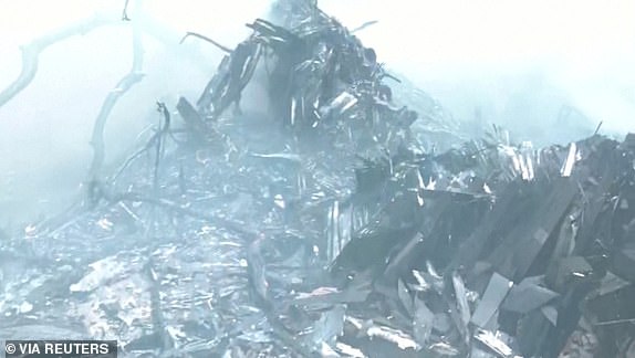 Smoke rises amidst debris after an Air India plane crashed in Ahmedabad, India, June 12, 2025, in this still image taken from video. ANI/Reuters TV via REUTERS    THIS IMAGE HAS BEEN SUPPLIED BY A THIRD PARTY. INDIA OUT. NO COMMERCIAL OR EDITORIAL SALES IN INDIA.