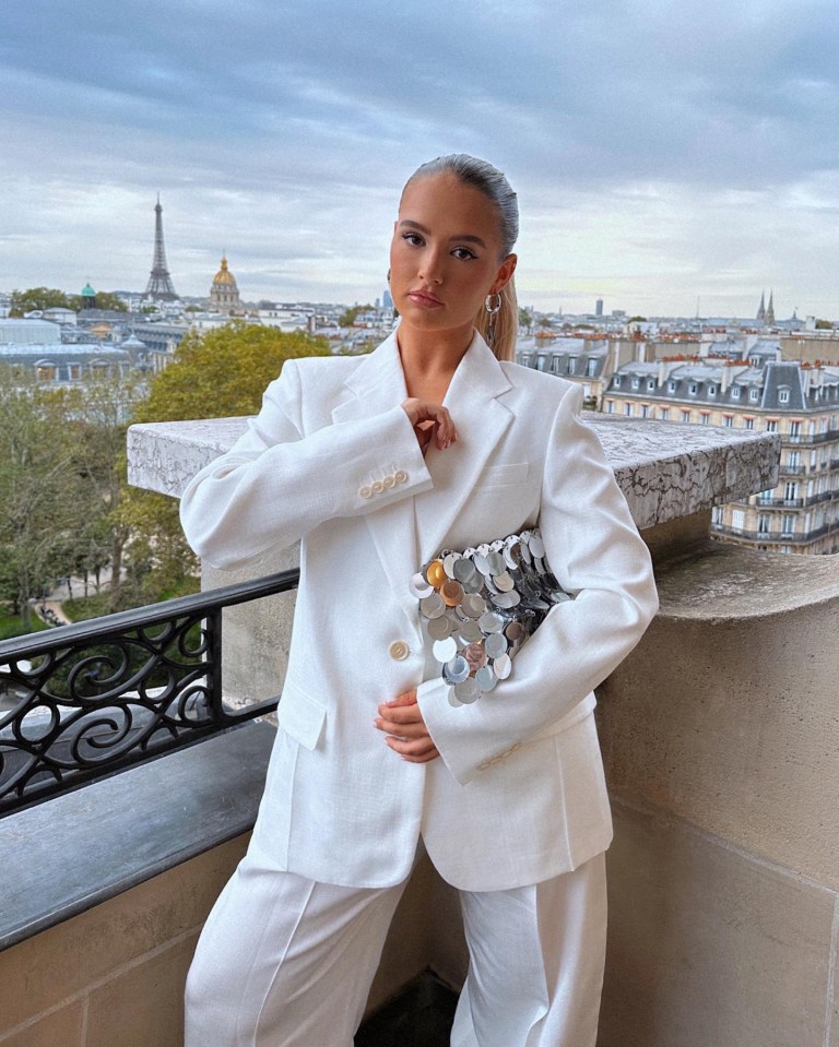 Molly-Mae Hague in Paris, wearing a white suit and sequined clutch.