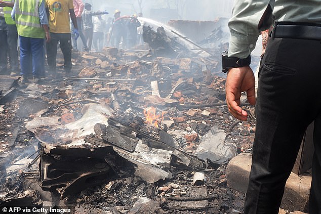 Debris is seen at the site where Air India flight 171 crashed in a residential area near the airport in Ahmedabad on June 12, 2025