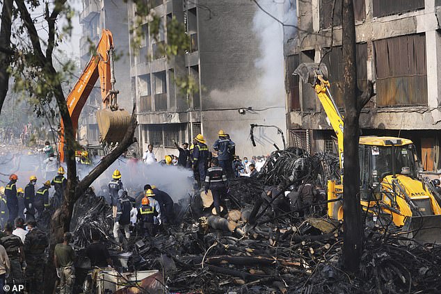 Search and rescue teams respond to the scene of a plane crash in Ahmedabad, India, Thursday, June 12, 2025