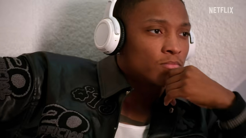 Still from Netflix's *Building the Band* showing a man wearing headphones.