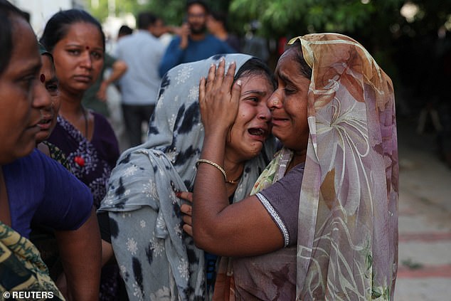 A family member cries upon hearing the news of her brother who died when the Air India Boeing 787 Dreamliner plane crashed in Ahmedabad, India, June 12, 2025