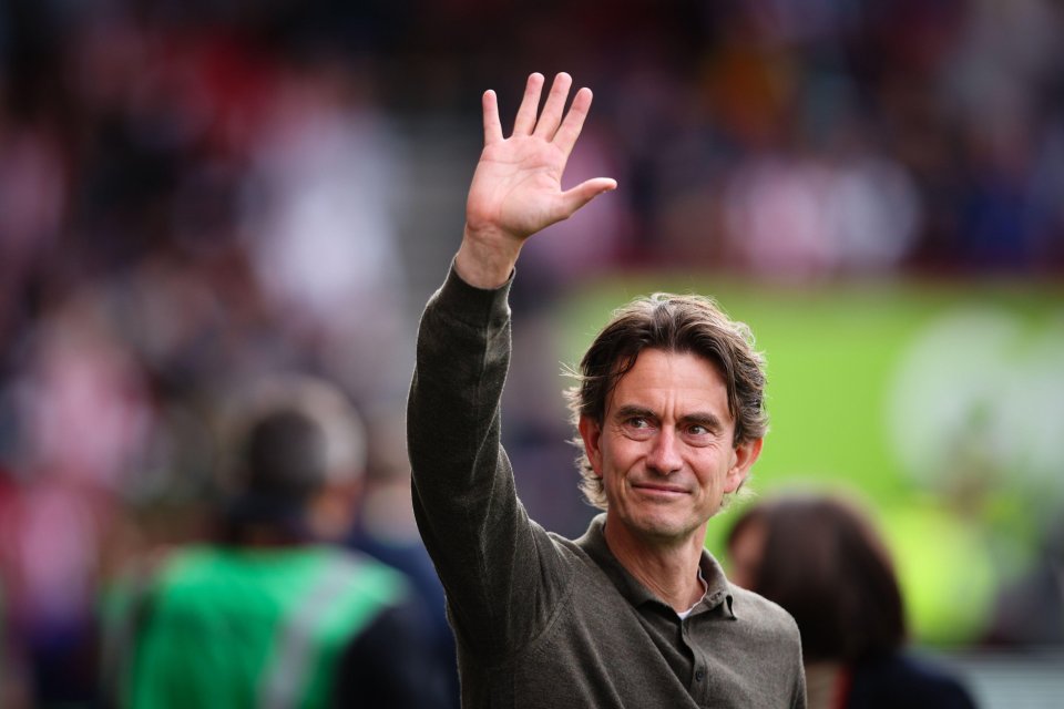 Brentford head coach Thomas Frank waving to fans.