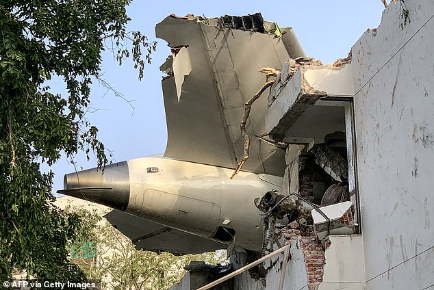 The back of Air India flight 171 is pictured at the site after it crashed in a residential area near the airport in Ahmedabad