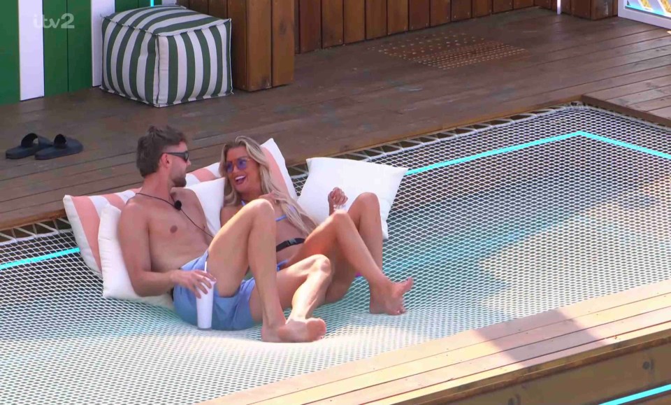 Couple relaxing in a hammock.