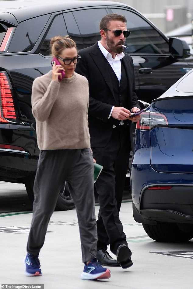 The cigarette dangled from Affleck's mouth