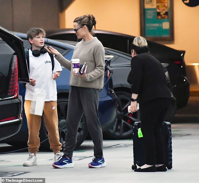 Once they located their son, Jennifer was seen chatting with the youngster, who stayed occupied with a pair of large headphones