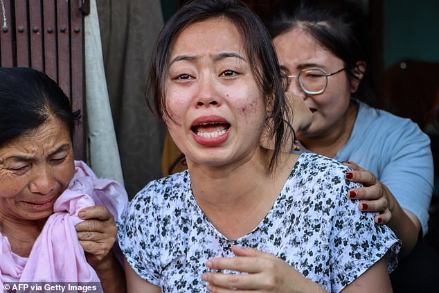 Family members of one of the crew members of Air India flight 171 mourn at their residence in Thoubal Mayai Leikai near Imphal June 12, 2025