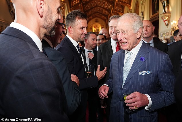 King Charles pictured speaking to guests during a reception for award recipients at Windsor Castle this evening