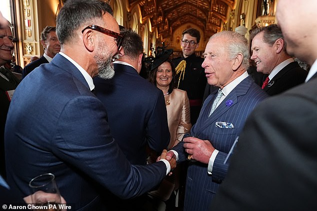 The monarch shook hands with people who were being honoured at the King's Award for Enterprise reception