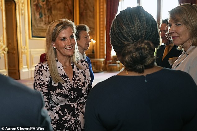 The mother-of-two smiled as she enjoyed conversations with guests, choosing to go for a laid back dewy make-up look