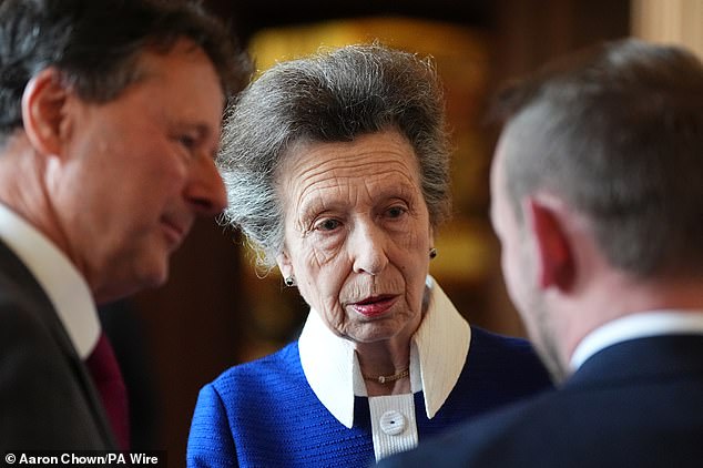 The Princess Royal styled her tresses in a classic up-do and sported deep red lipstick this evening