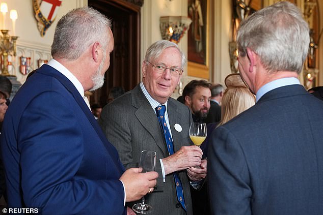 Richard sported a grey suit for the evening, and was seen chatting with attendees at the reception