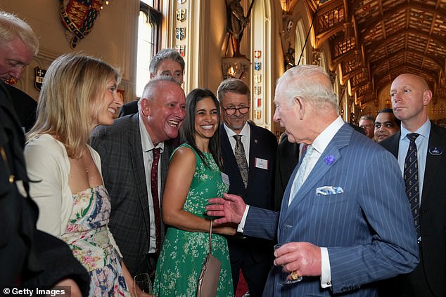 Beaming Charles looked to entertain crowds of guests as he chatted with people at the reception