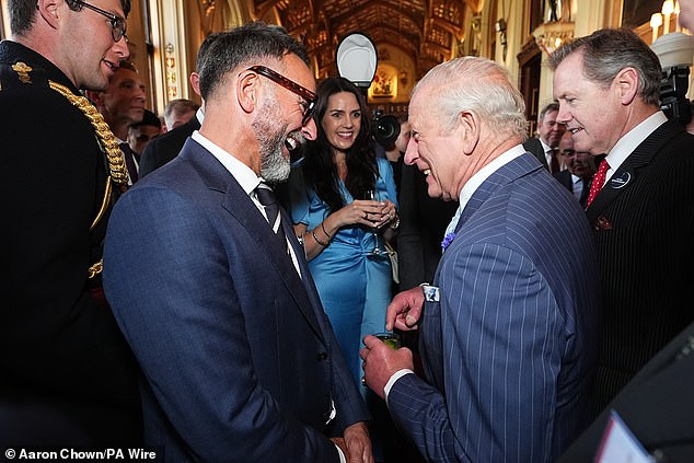 It was a cheerful evening at Windsor Castle as Charles enjoyed conversing with reception attendees