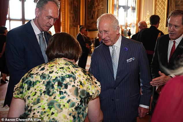 The King was animated as he enjoyed conversations with several guests at Windsor Castle tonight