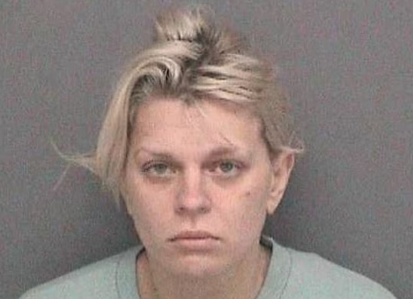 Mugshot of a woman with blonde hair.