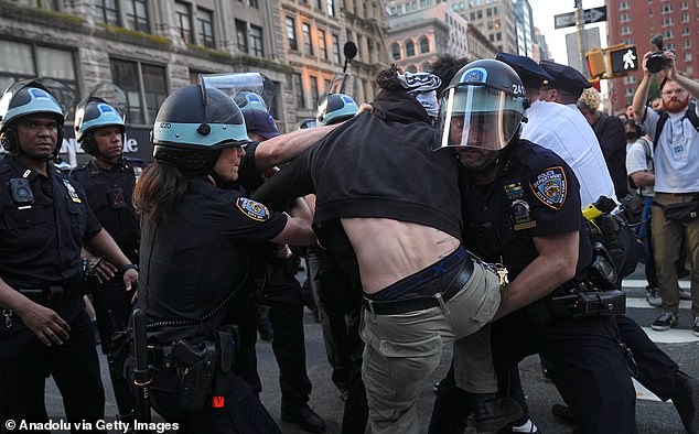 Protests have spread throughout the nation too, popping up in New York (pictured), Texas, Arizona and Chicago as authorities' resources are spread thin trying to maintain order