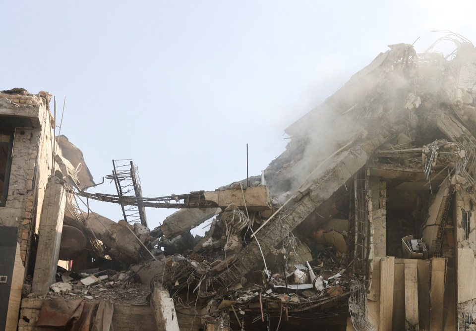 Smoke rises from a damaged building.