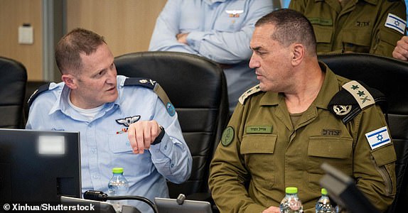 Mandatory Credit: Photo by Xinhua/Shutterstock (15355156b) This photo issued by Israel Defense Forces (IDF) on June 13, 2025 shows Israeli army chief Eyal Zamir (R) overseeing IDF strikes against Iran at the Israeli Air Force situation room in Israel. Israeli Defense Minister Israel Katz said on Friday that Israel has launched a "preemptive strike" on Iran.  IDF confirmed in a statement that its jets have completed the first-stage attack, notably strikes on dozens of military targets, including nuclear targets in different areas of Iran.  Israeli Prime Minister Benjamin Netanyahu said in a video address that the goal of the ongoing operation is "to strike Iran's nuclear infrastructure, Iran's ballistic missile factories, and Iran's military capabilities," and will continue "for as many days as it takes." Israel Idf Iran Strike - 13 Jun 2025