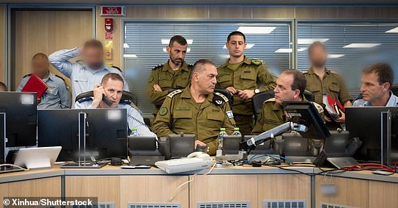 Mandatory Credit: Photo by Xinhua/Shutterstock (15355156a) This photo issued by Israel Defense Forces (IDF) on June 13, 2025 shows Israeli army chief Eyal Zamir (C) overseeing IDF strikes against Iran at the Israeli Air Force situation room in Israel. Israeli Defense Minister Israel Katz said on Friday that Israel has launched a "preemptive strike" on Iran.  IDF confirmed in a statement that its jets have completed the first-stage attack, notably strikes on dozens of military targets, including nuclear targets in different areas of Iran.  Israeli Prime Minister Benjamin Netanyahu said in a video address that the goal of the ongoing operation is "to strike Iran's nuclear infrastructure, Iran's ballistic missile factories, and Iran's military capabilities," and will continue "for as many days as it takes." Israel Idf Iran Strike - 13 Jun 2025