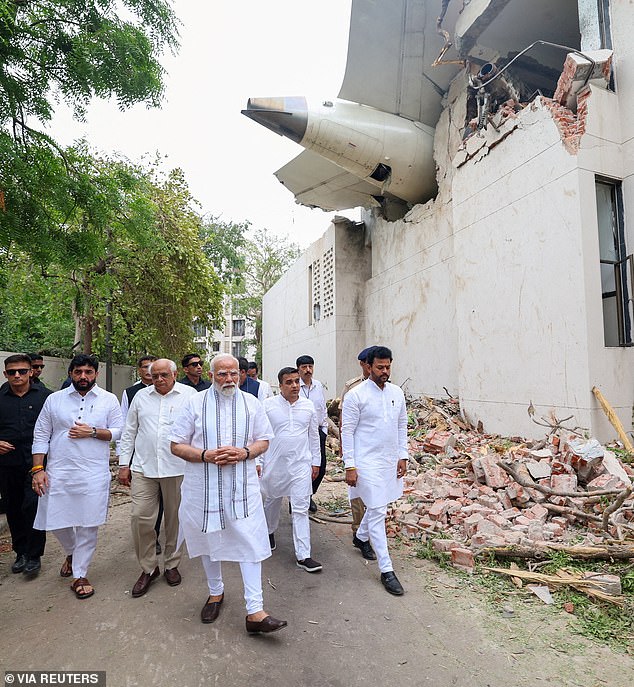 India's Prime Minister Narendra Modi visits the site where an Air India Boeing 787-8 Dreamliner, bound for London's Gatwick Airport, crashed during take-off from Ahmedabad