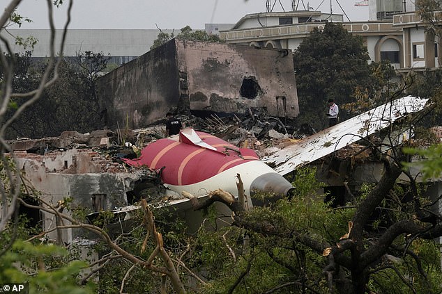Parts of an Air India plane that crashed on Thursday are seen on top of a building in Ahmedabad, India, Friday, June 13