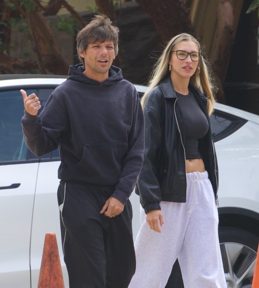 Louis Tomlinson and Zara McDermott holding hands in Malibu.