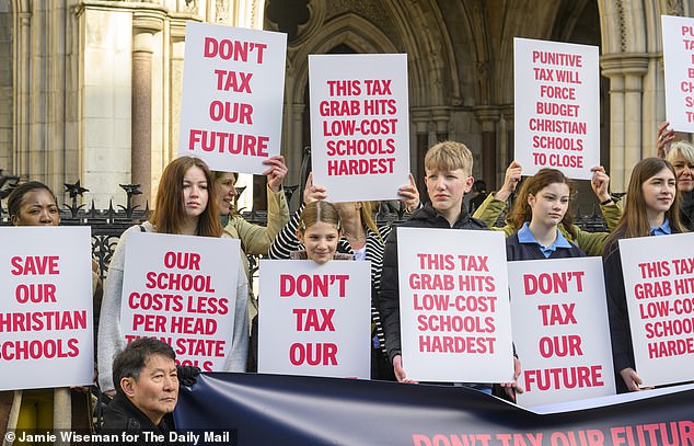 The judicial review claim, heard earlier this year, aimed to have the 20 per cent tax overturned – benefitting half a million pupils nationwide (pictured: pupils protesting earlier this year)