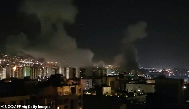 This image grab taken from UGC footage broadcast by Iran TV on June 13, 2025 shows smoke billowing from explosions in Tehran