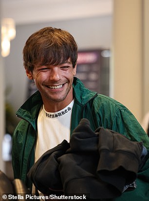 Beaming Louis was captured arriving and making his way onto the pitch