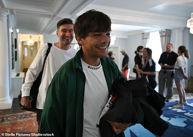 Louis walked through the hotel to the training pitch beaming