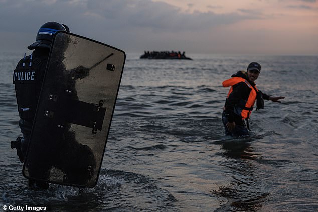 Some officers were seen entering the water and dragging them back to shore