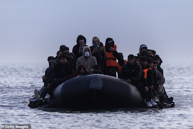 An overloaded boat just off the French shore in Gravelines, northern France
