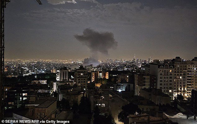 Smoke billowing from a site reportedly targeted by an Israeli strike in Tehran