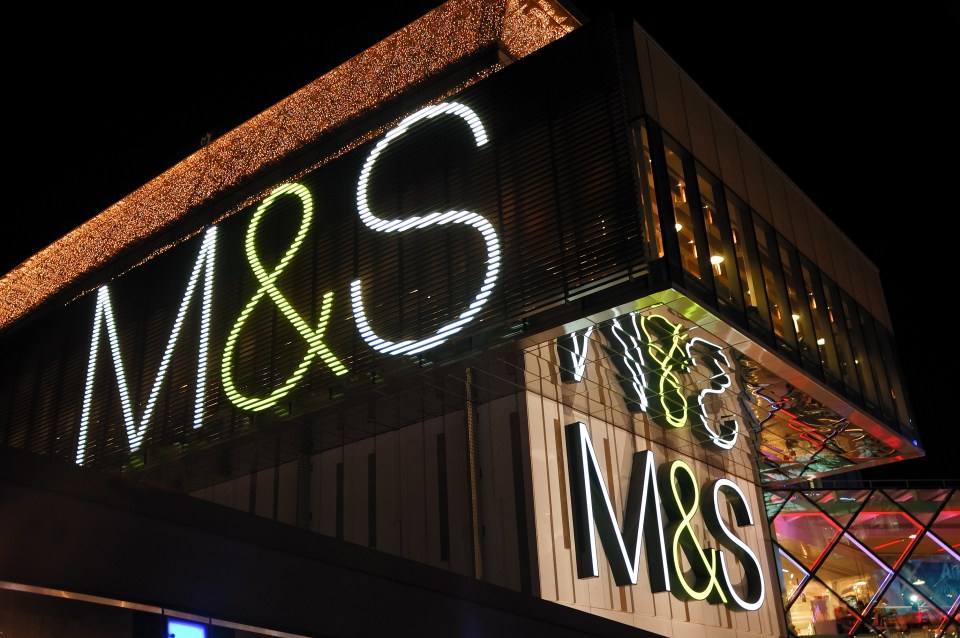 Marks & Spencer store at Westfield shopping center at night.