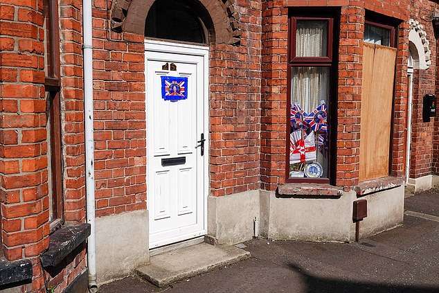 People have put Union Jacks and signs saying they were locals on doors and in windows to try and protect their property from migrant-targeting arsonists
