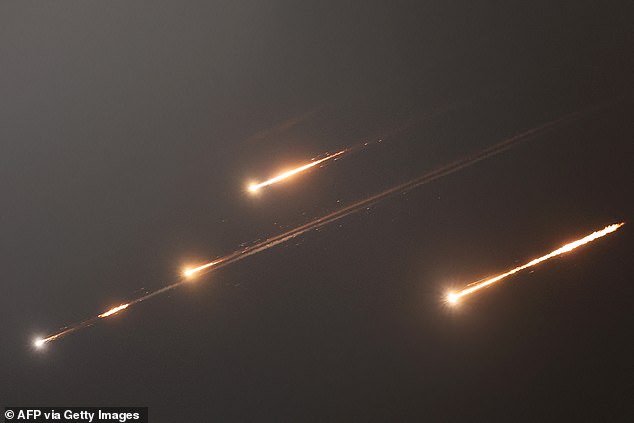 Rocket trails in the sky above Jerusalem after Iran fired missiles on Israel
