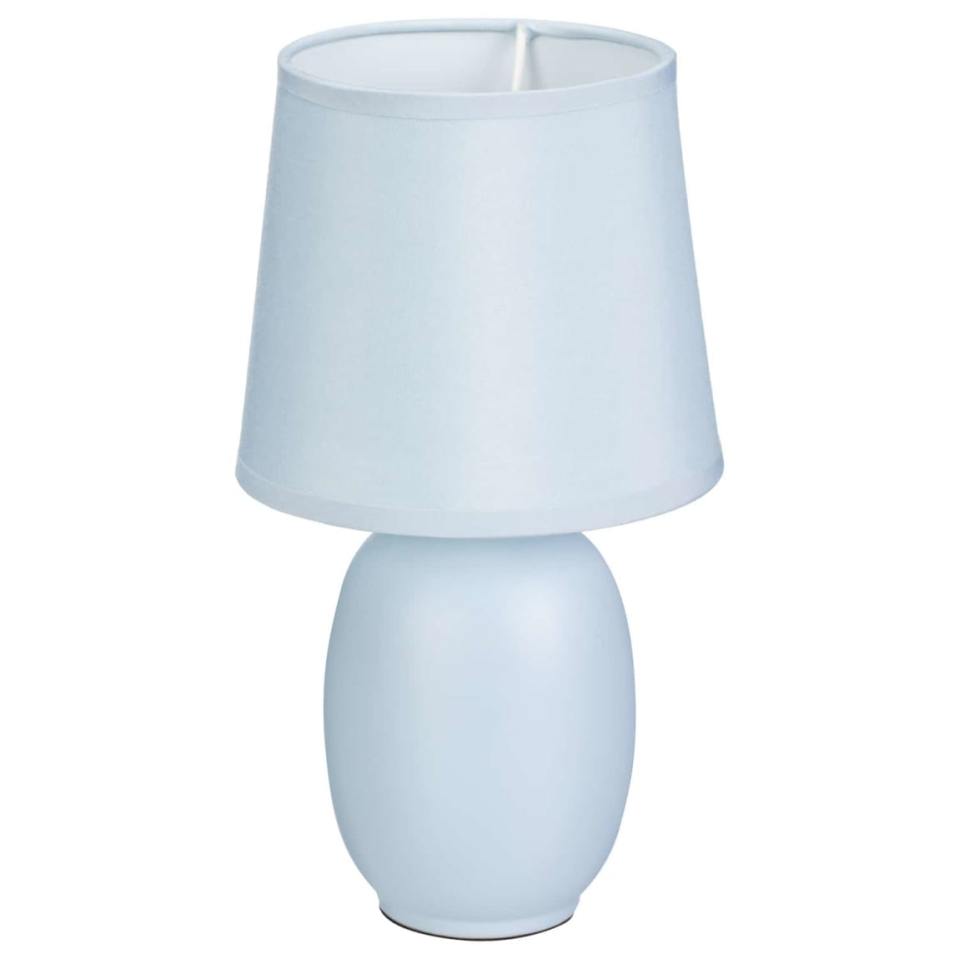 Light blue table lamp with a matching shade.