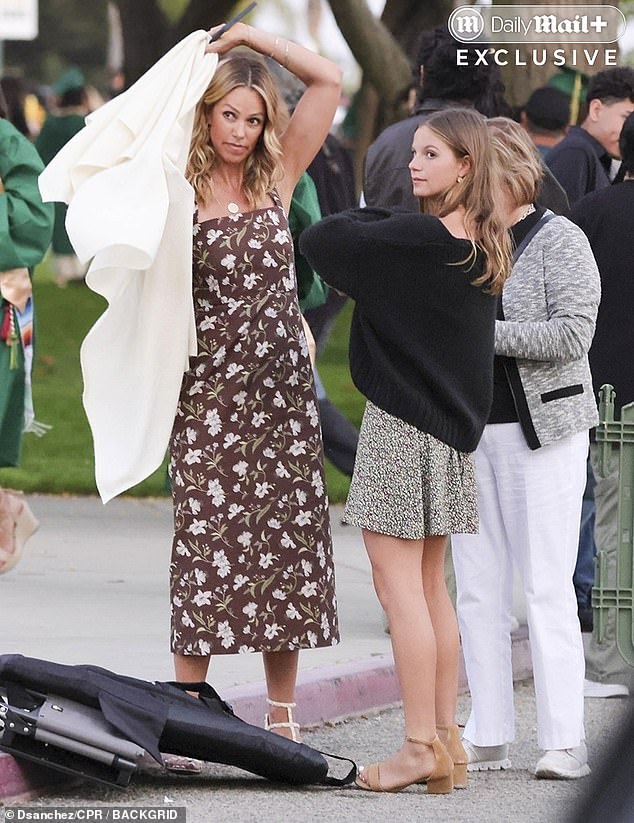 Christine, for her part, looked radiant in a floral dress, flashing a wide smile as she posed for photos with Cayden