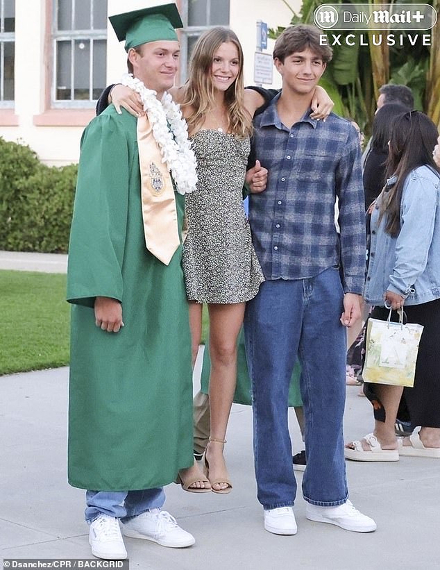 Although unconfirmed, it appeared that Kevin and Christine's other children — Hayes Logan, 16, and Grace Avery, 15 — were also in attendance at the graduation, posing for photos with Cayden
