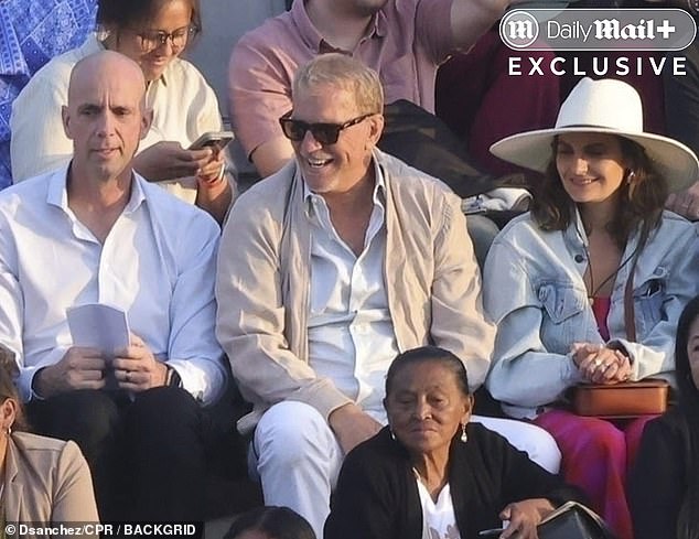 At one moment during the ceremony, Kevin was seen watching from the stands alone