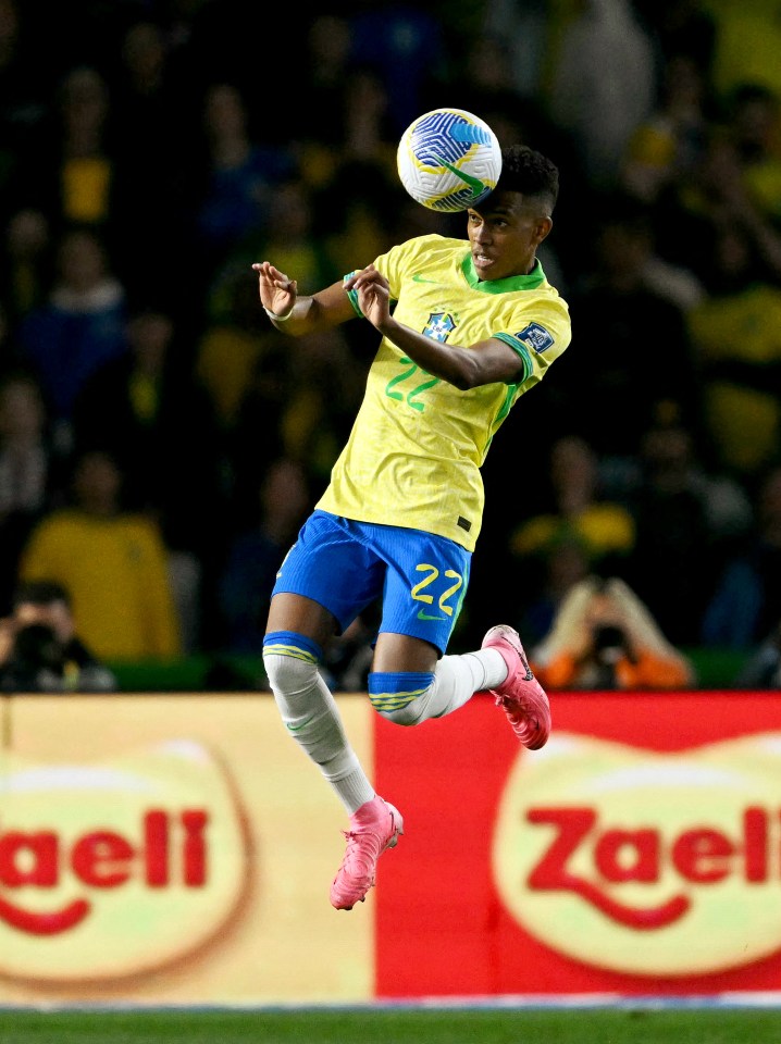 Brazilian soccer player heading the ball during a match.