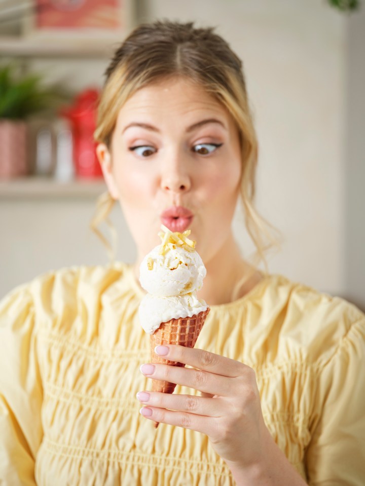 Woman looking surprised at a potato ice cream cone.